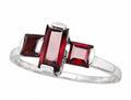 Rich deep-red garnet stones set in polished sterling silver ring.