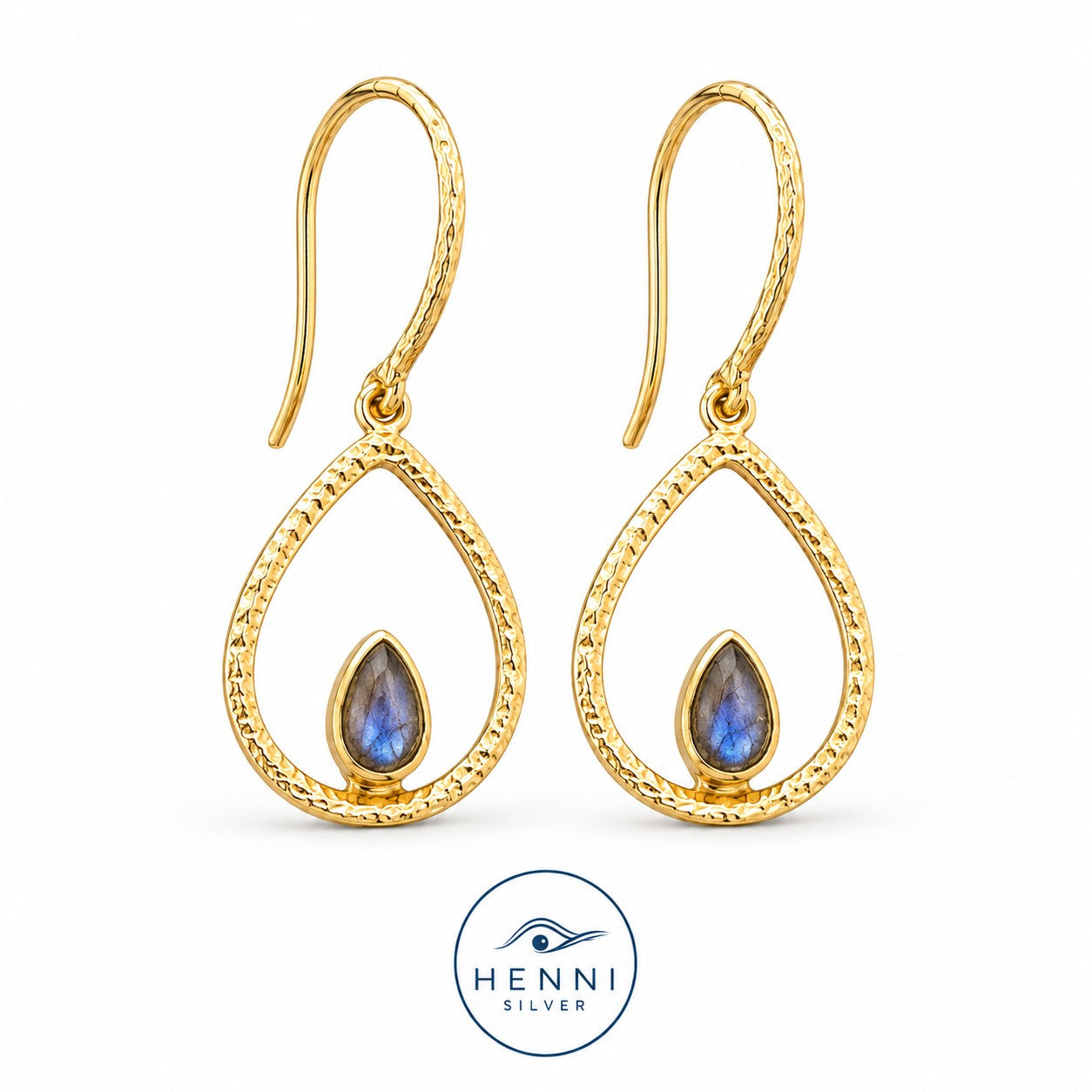Hook swing earrings with a petite turquoise gem nestled in a warm gold-over-brass teardrop shape