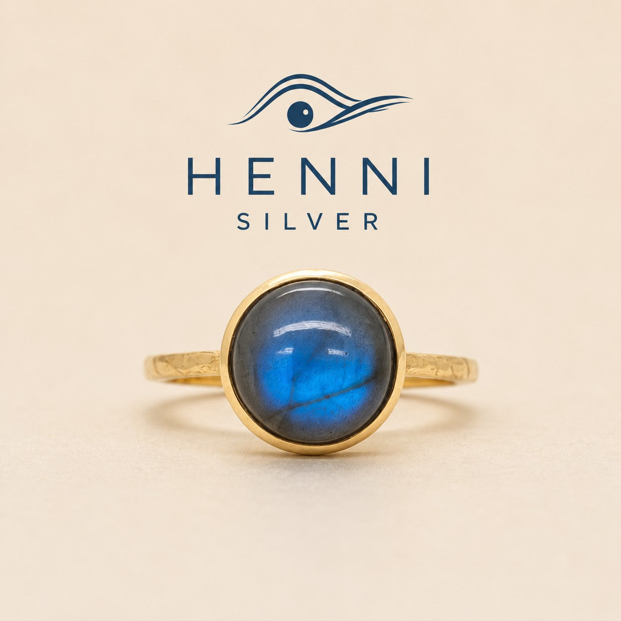 A smooth petite labradorite gemstone ring wrapped in a delicate embrace of 0.5 micron 14-carat gold over brass