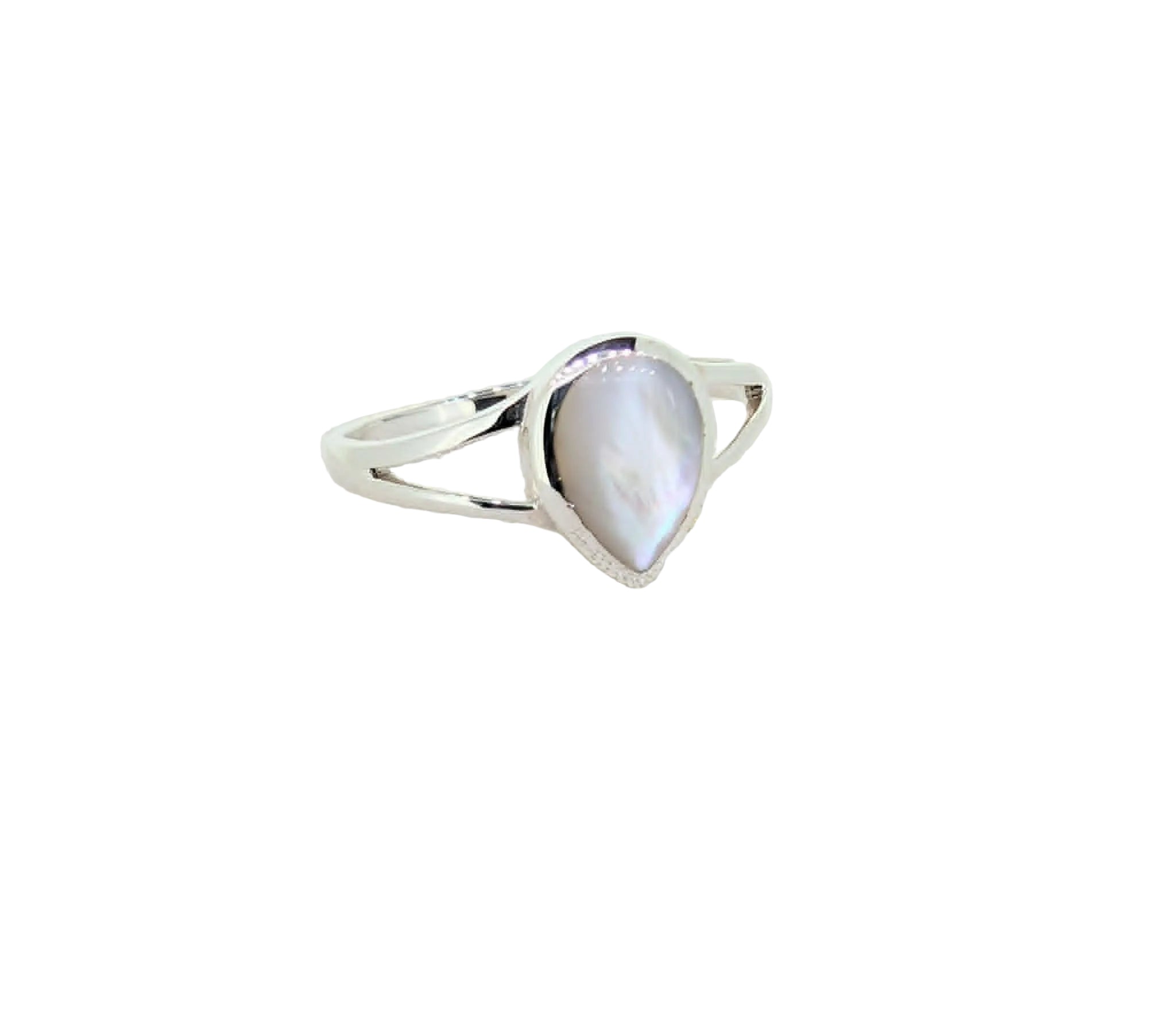 Silver ring with a teardrop-shaped gemstone on a textured beige surface