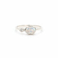Rainbow moonstone held in a fine claw setting with a tiny zirconia on the side - Set in sterling silver thin curved band