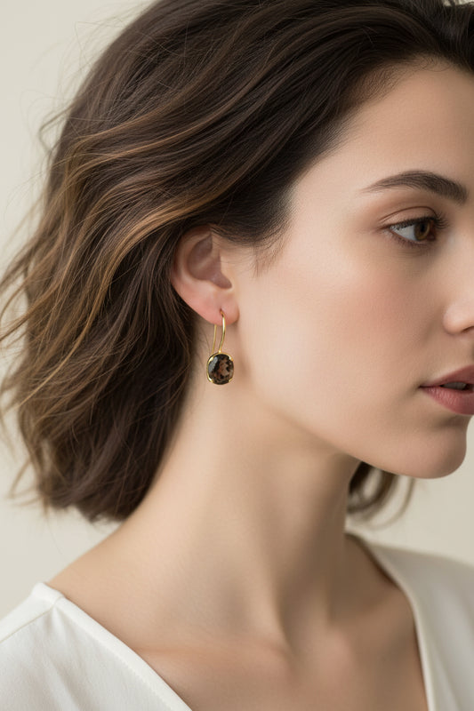 Gold plated sterling silver smoky quartz hook earrings feature beautifully cut smoky quartz gemstone embraced in a modern snug wrap setting