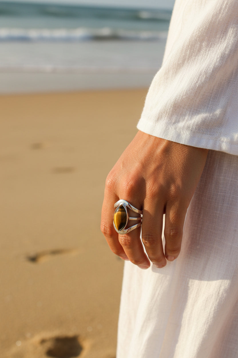Silver ring with a oval-shaped tiger's eye stone 