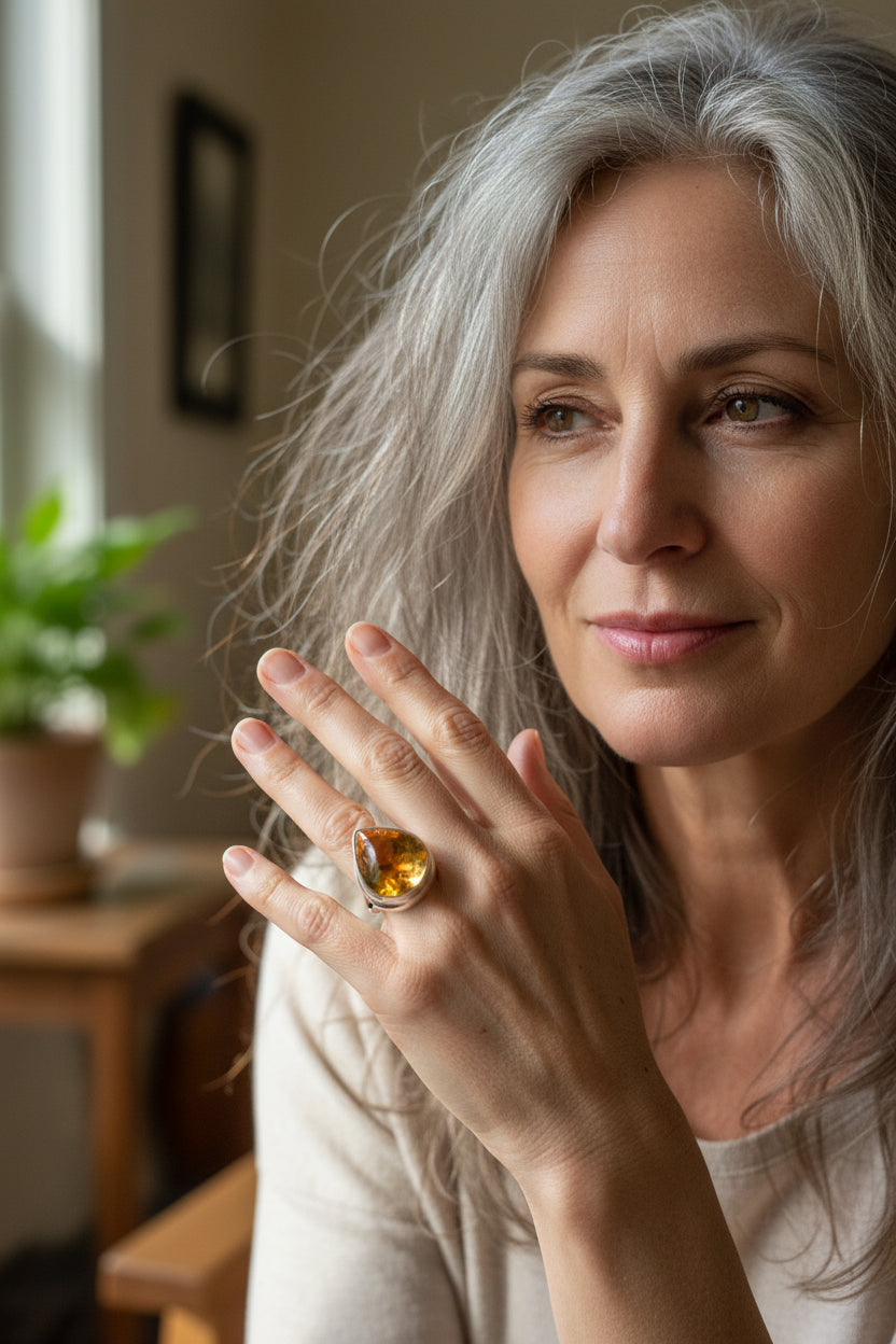 A striking statement ring featuring a glowing teardrop citrine cabochon set in polished sterling silver