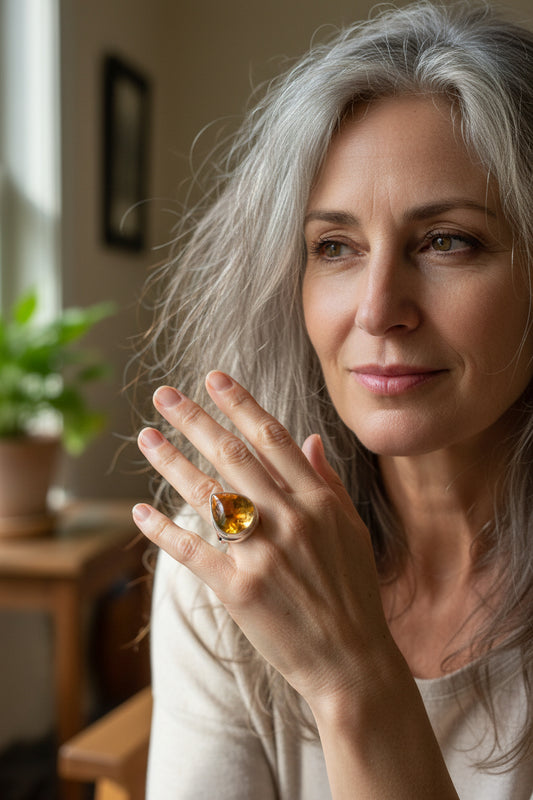 A striking statement ring featuring a glowing teardrop citrine cabochon set in polished sterling silver