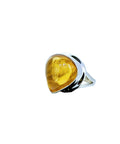 A striking statement ring featuring a glowing teardrop citrine cabochon set in polished sterling silver